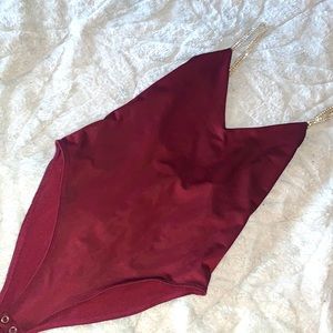 Beautiful burgundy body suit , with diamond straps . Perfect for a night out<3